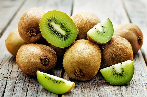 kiwi on white wood background. tinting. selective focus